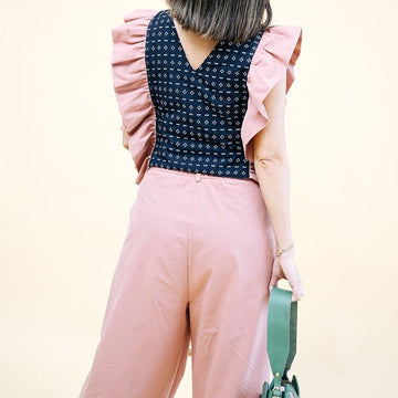 The Ruffled Bib Purposeful Pink in Cross Black Sinukitan